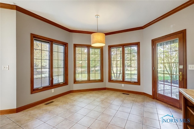 interior space featuring ornamental molding and light tile patterned floors