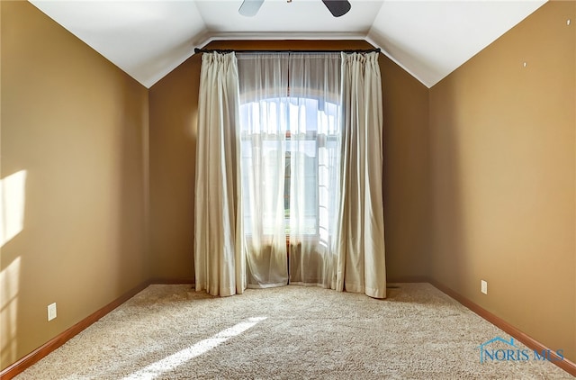 bonus room featuring lofted ceiling, carpet, and ceiling fan