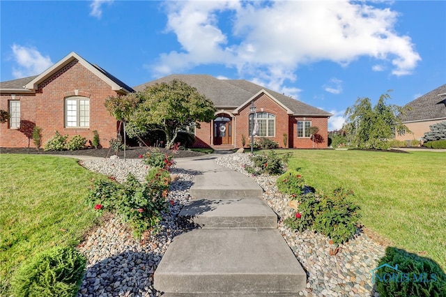 ranch-style house with a front lawn