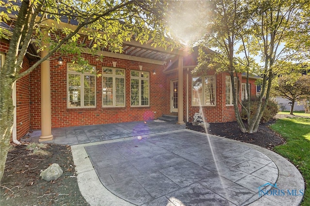 exterior space with a patio area and a pergola