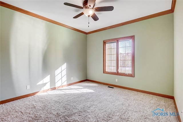 unfurnished room featuring crown molding, carpet, and ceiling fan