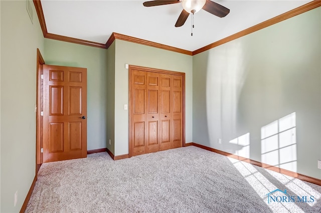 unfurnished bedroom with ornamental molding, light carpet, a closet, and ceiling fan