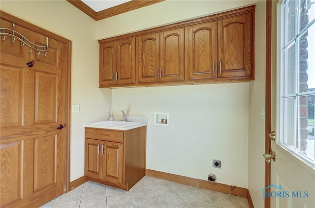 laundry room with hookup for a washing machine, light tile patterned flooring, electric dryer hookup, ornamental molding, and cabinets