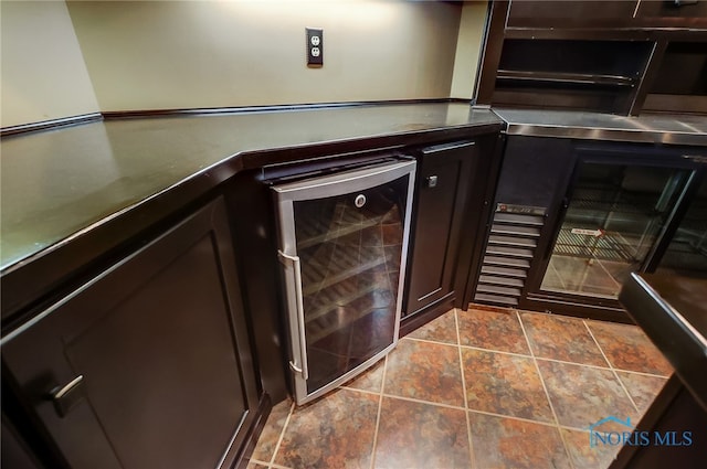 details with wine cooler and dark brown cabinets