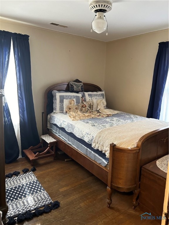 bedroom featuring dark wood-type flooring