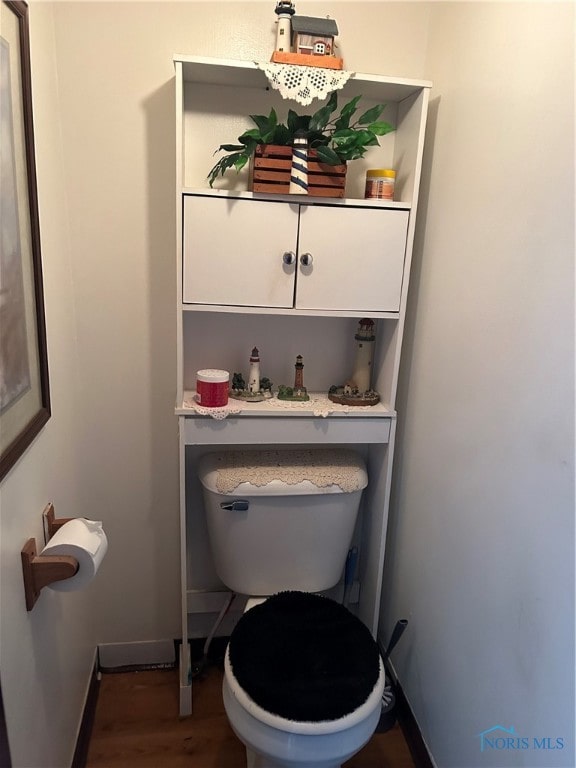 bathroom featuring toilet and hardwood / wood-style flooring