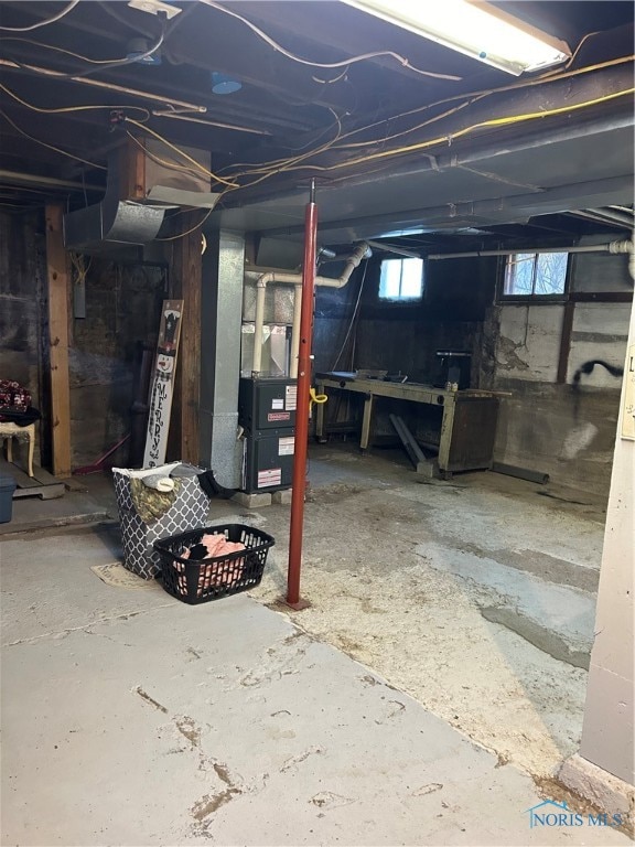 basement featuring heating unit