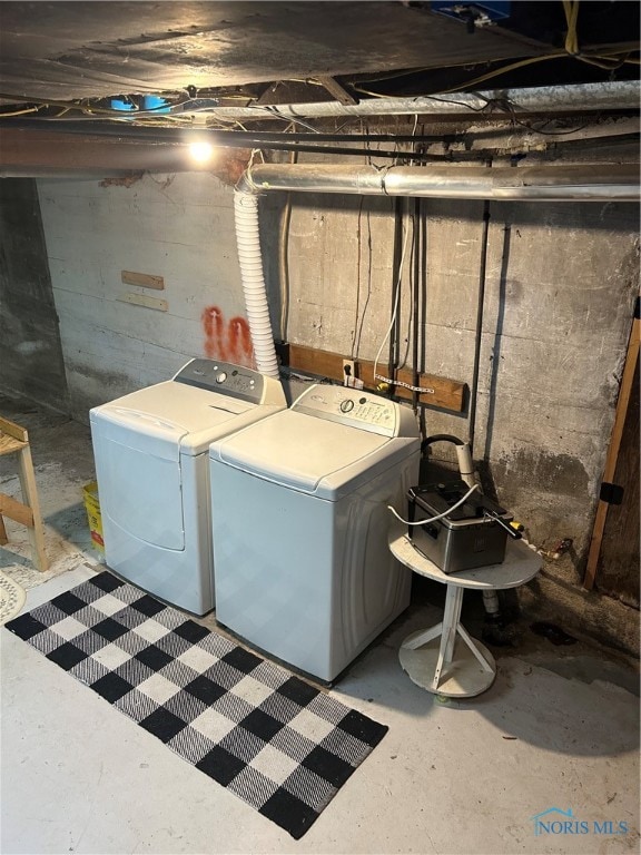 washroom with independent washer and dryer