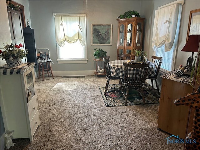 view of carpeted dining area