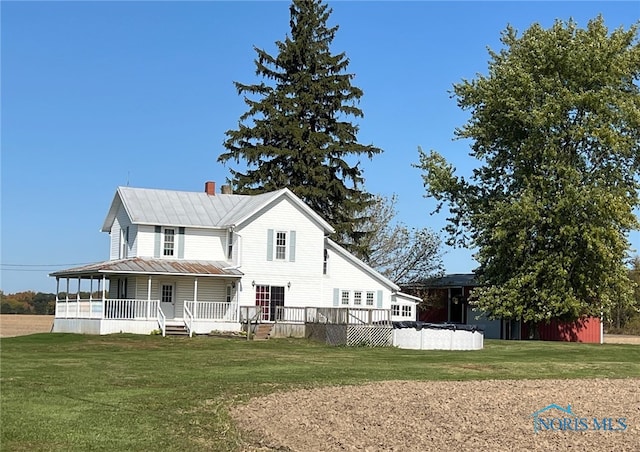 view of front of property with a porch and a front yard