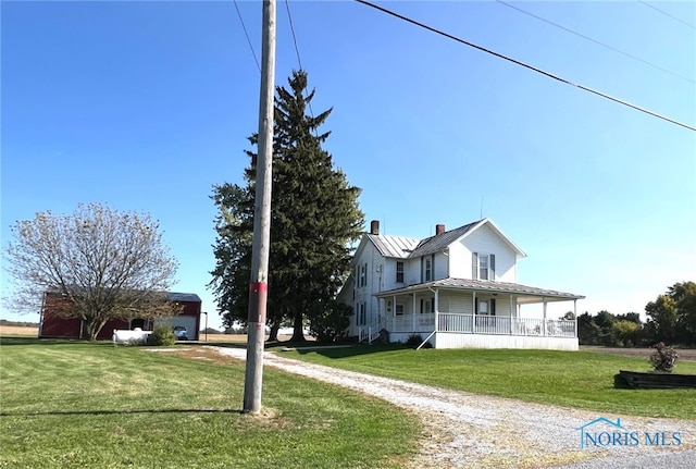 exterior space with a front yard and covered porch