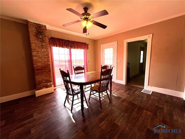 dining room with crown molding, dark hardwood / wood-style floors, and ceiling fan