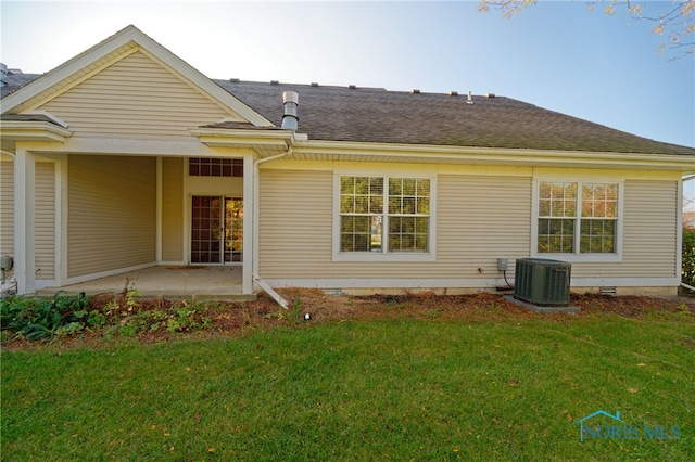 back of house featuring a yard, a patio area, and central AC unit