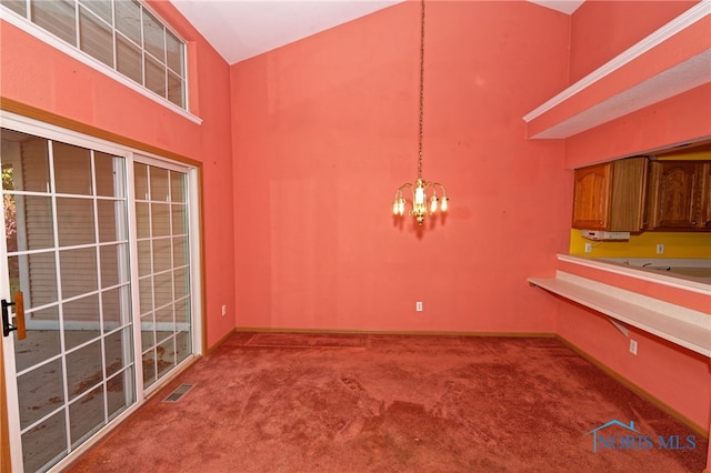 unfurnished dining area featuring an inviting chandelier, carpet floors, and a high ceiling