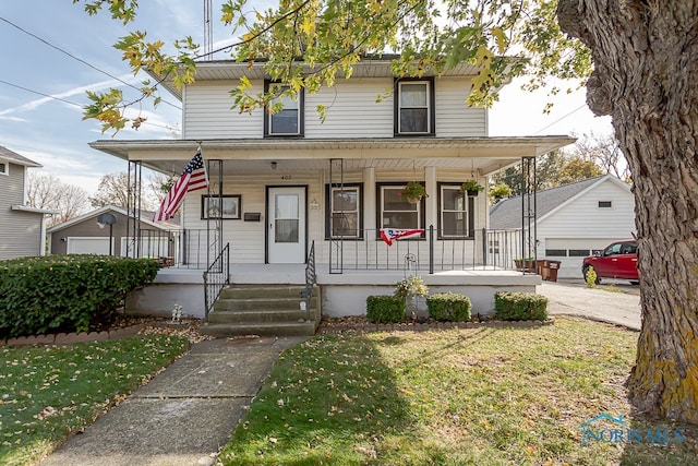 country-style home featuring a front yard and a porch