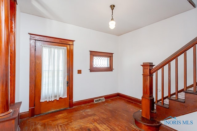 entrance foyer featuring parquet floors