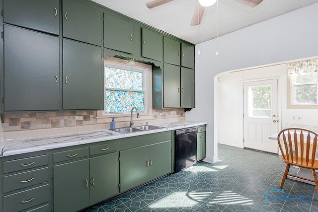 kitchen featuring dishwasher, sink, green cabinetry, tasteful backsplash, and ceiling fan