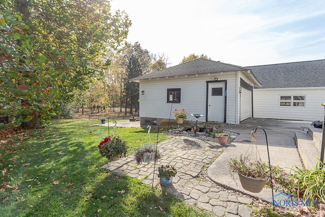 exterior space with a patio and a lawn