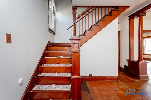 stairs featuring decorative columns