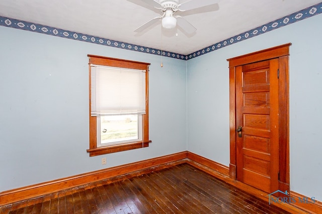 empty room featuring hardwood / wood-style flooring and ceiling fan