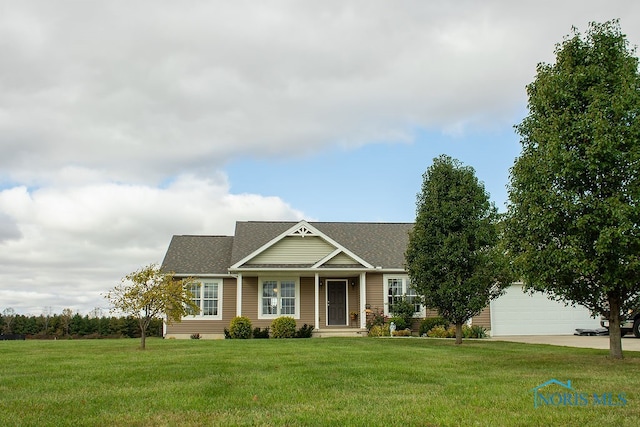 view of front of house with a front lawn and a garage