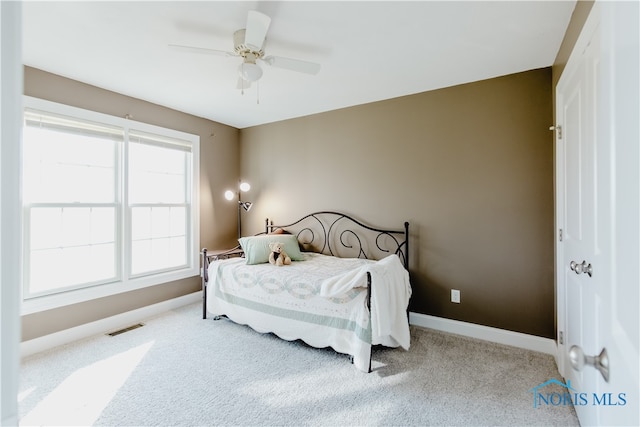 carpeted bedroom with ceiling fan