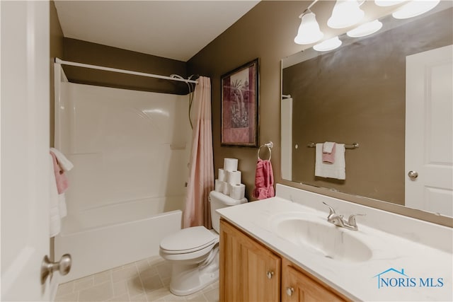 full bathroom featuring vanity, shower / bath combo with shower curtain, toilet, and tile patterned floors