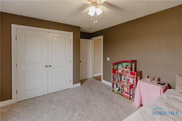 game room with ceiling fan and light carpet