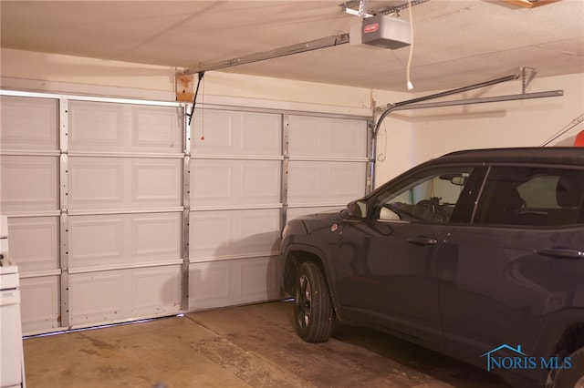 garage featuring a garage door opener