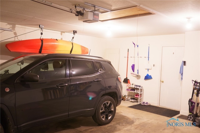 garage featuring a garage door opener