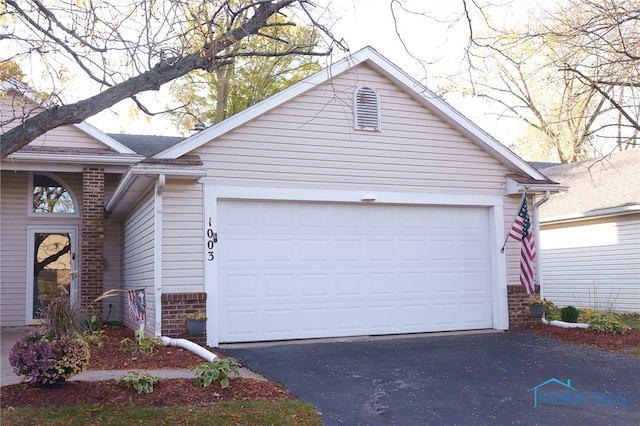 exterior space with a garage