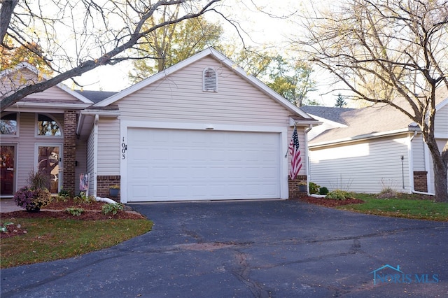 ranch-style home with a garage