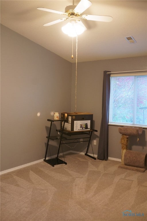 interior space featuring ceiling fan