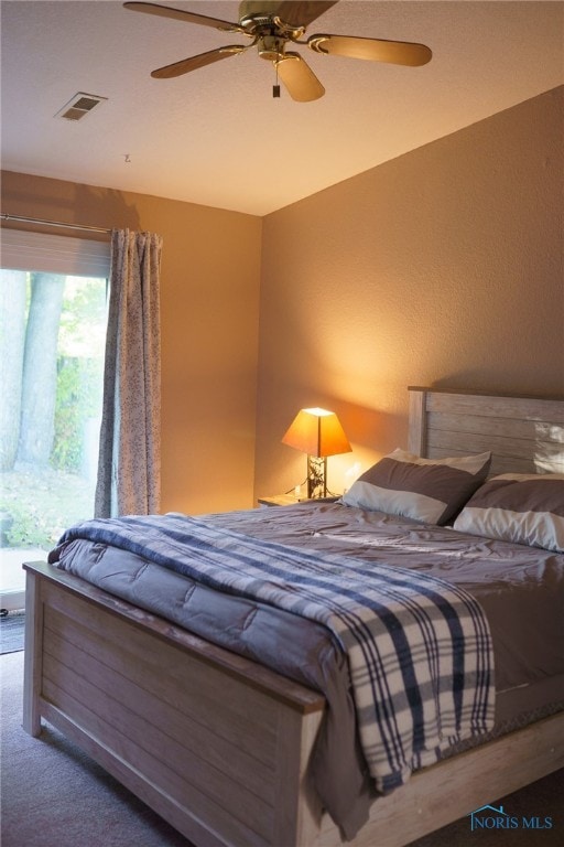 carpeted bedroom with ceiling fan