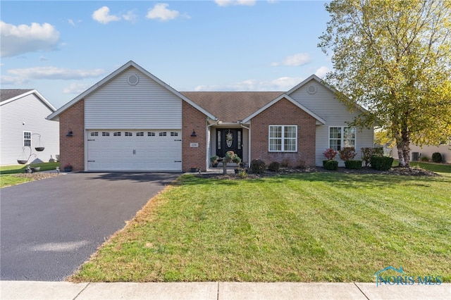 single story home featuring a front lawn and a garage