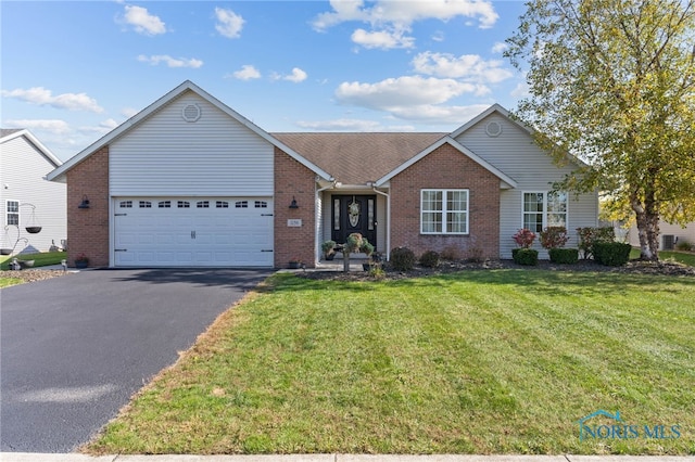 ranch-style home featuring a front lawn and a garage