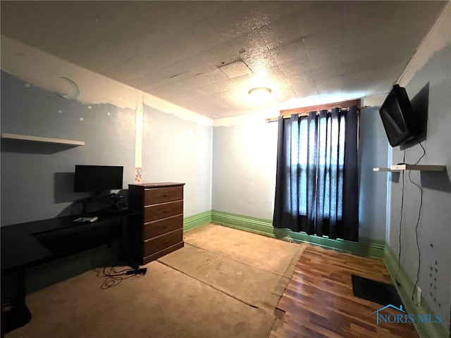 bedroom with wood-type flooring