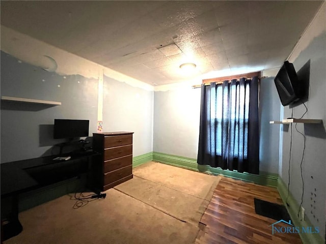 213 E Johnson St, Upper Sandusky, OH 43351 - bedroom featuring baseboards and wood finished floors