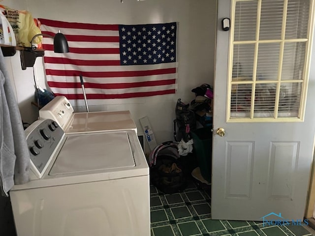 laundry room featuring washing machine and clothes dryer