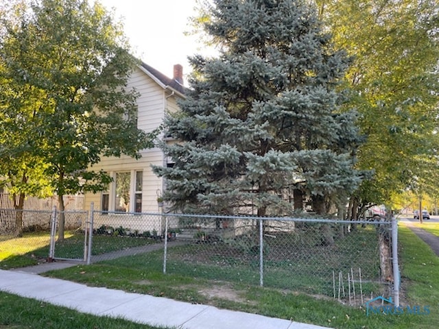 view of side of home featuring a yard