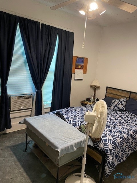 bedroom featuring cooling unit, carpet, and ceiling fan