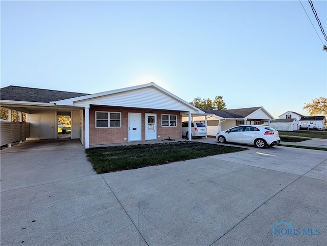 ranch-style house with a carport