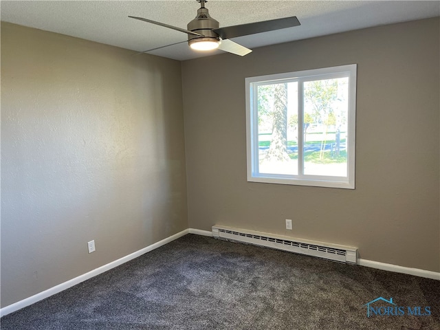 carpeted empty room with baseboard heating and ceiling fan