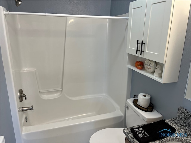 full bathroom featuring toilet, vanity, and shower / bathtub combination