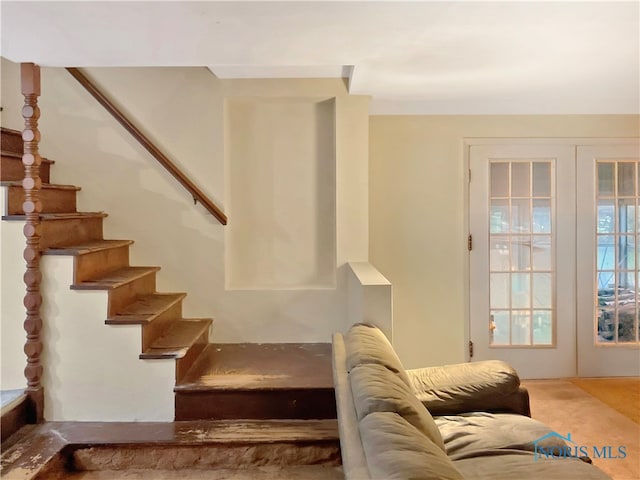 stairway featuring french doors