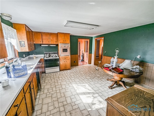 kitchen with sink and white appliances