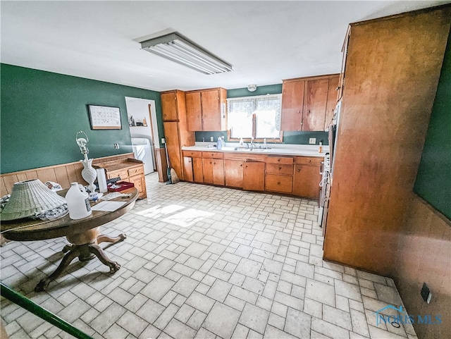 kitchen with sink and washer / clothes dryer