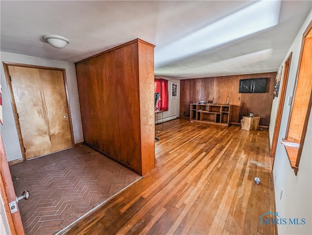 interior space featuring wooden walls and wood-type flooring