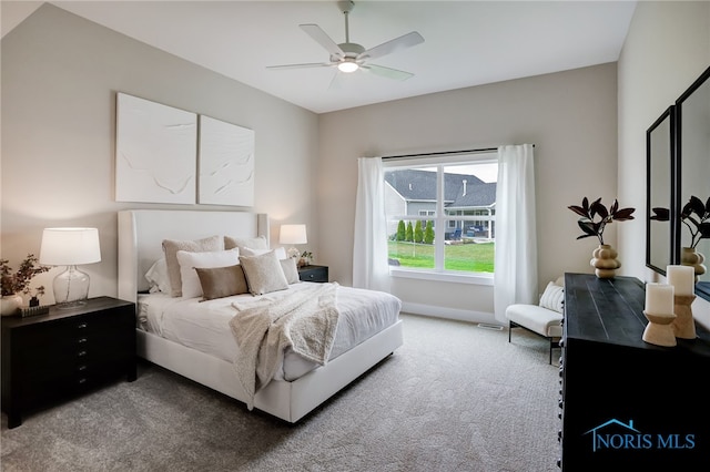 carpeted bedroom featuring ceiling fan