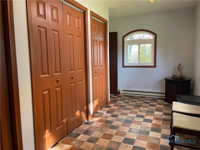 corridor featuring baseboard heating